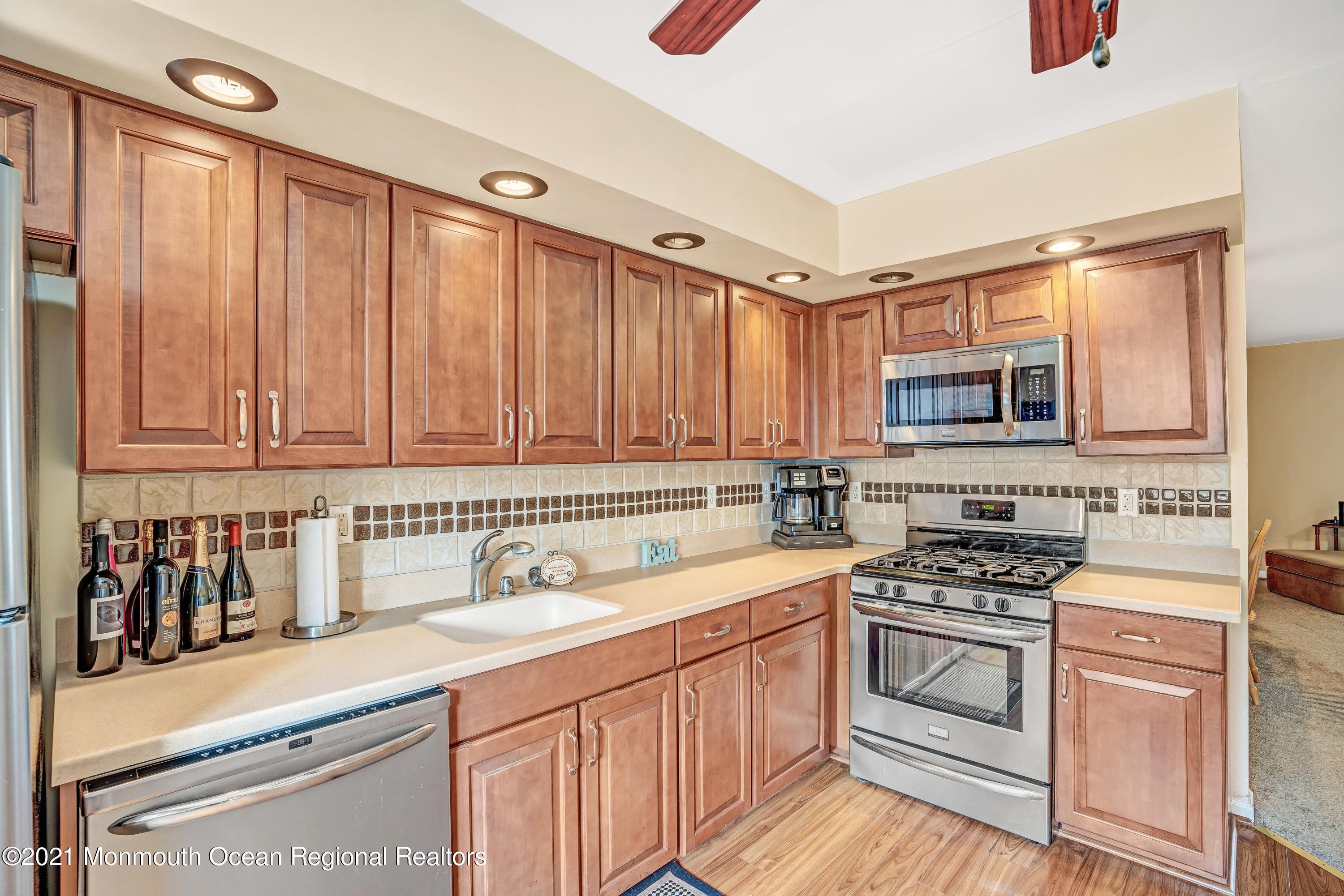 2101 Alpine Trail Neptune Township, NJ 07753 - Photo 11 of 24 a kitchen with a sink stove and cabinets