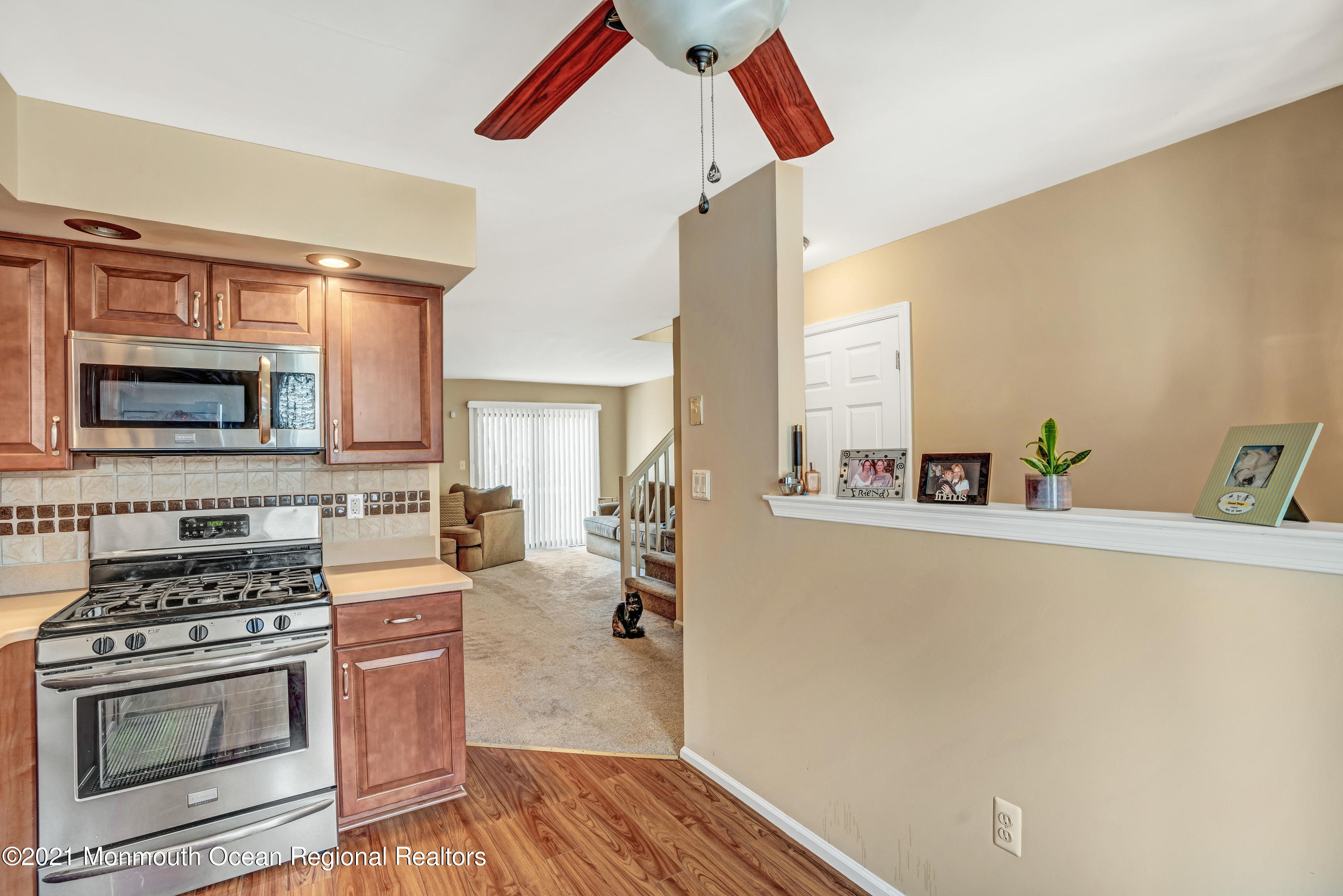 2101 Alpine Trail Neptune Township, NJ 07753 - Photo 12 of 24 a kitchen with a stove and a microwave