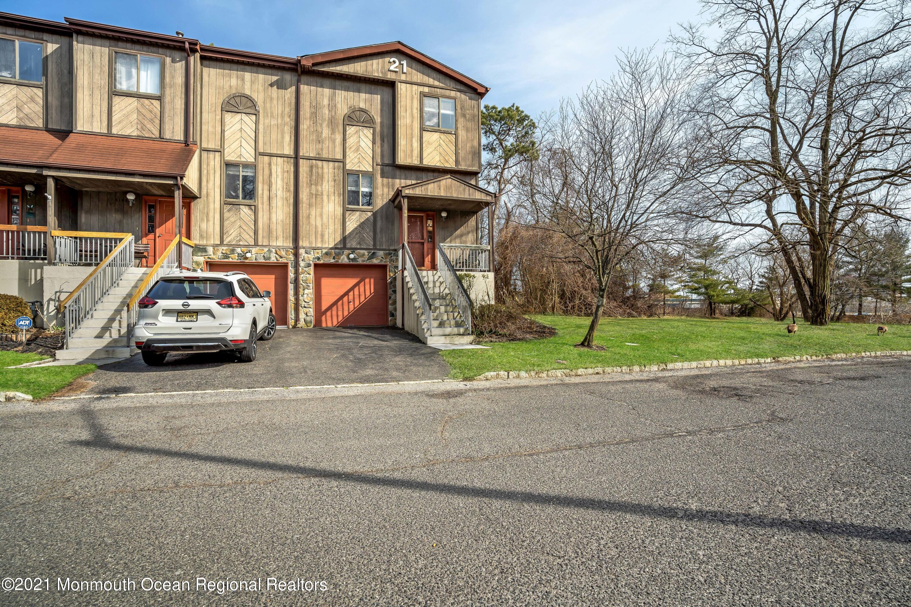 2101 Alpine Trail Neptune Township, NJ 07753 - Photo 20 of 24 a car parked in front of a house