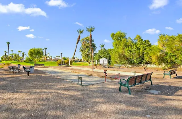 a view of a yard with table and chairs