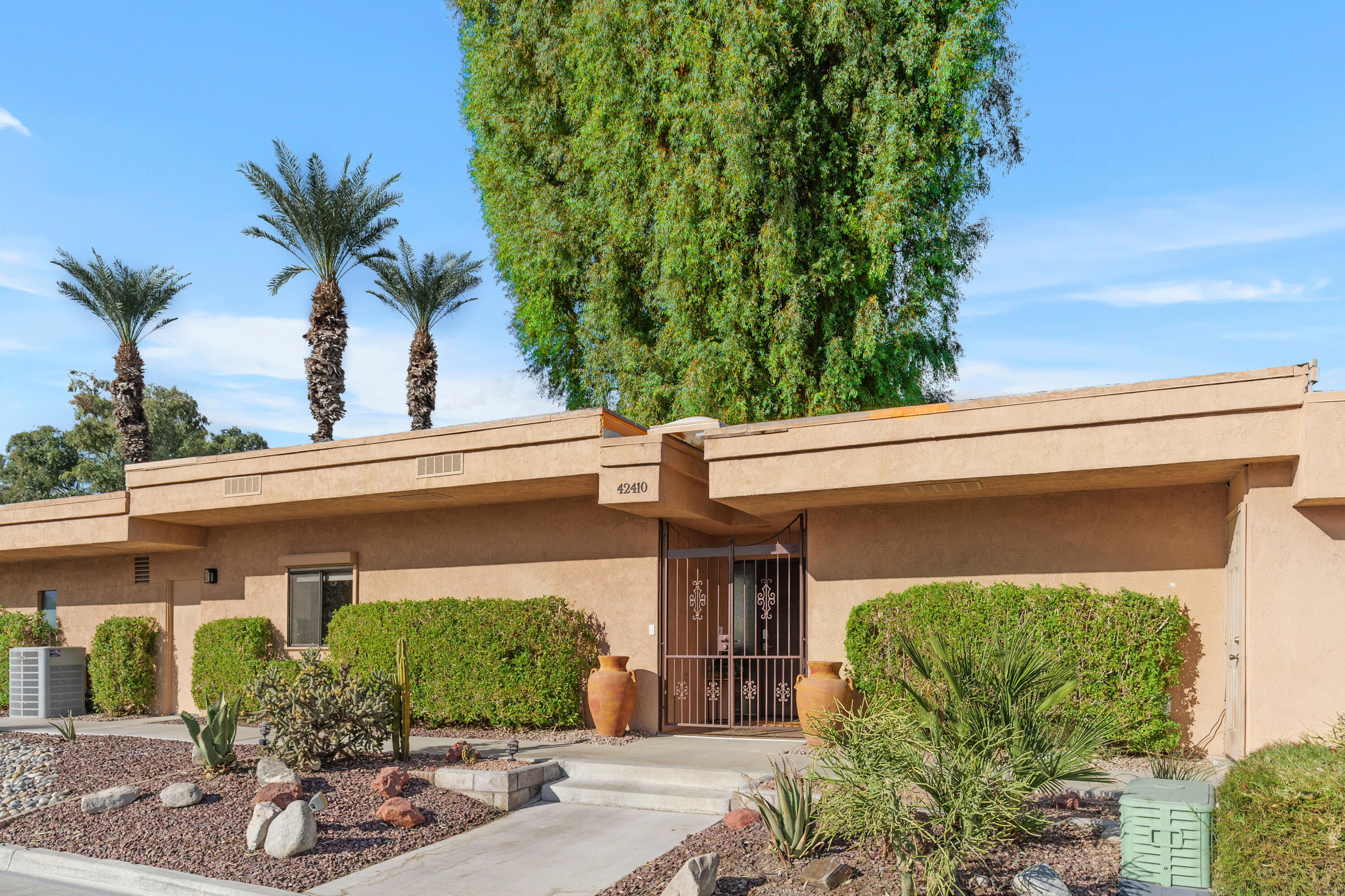 42410 Adams Street Bermuda Dunes, CA 92203 - Photo 7 of 39 a front view of a house with a yard