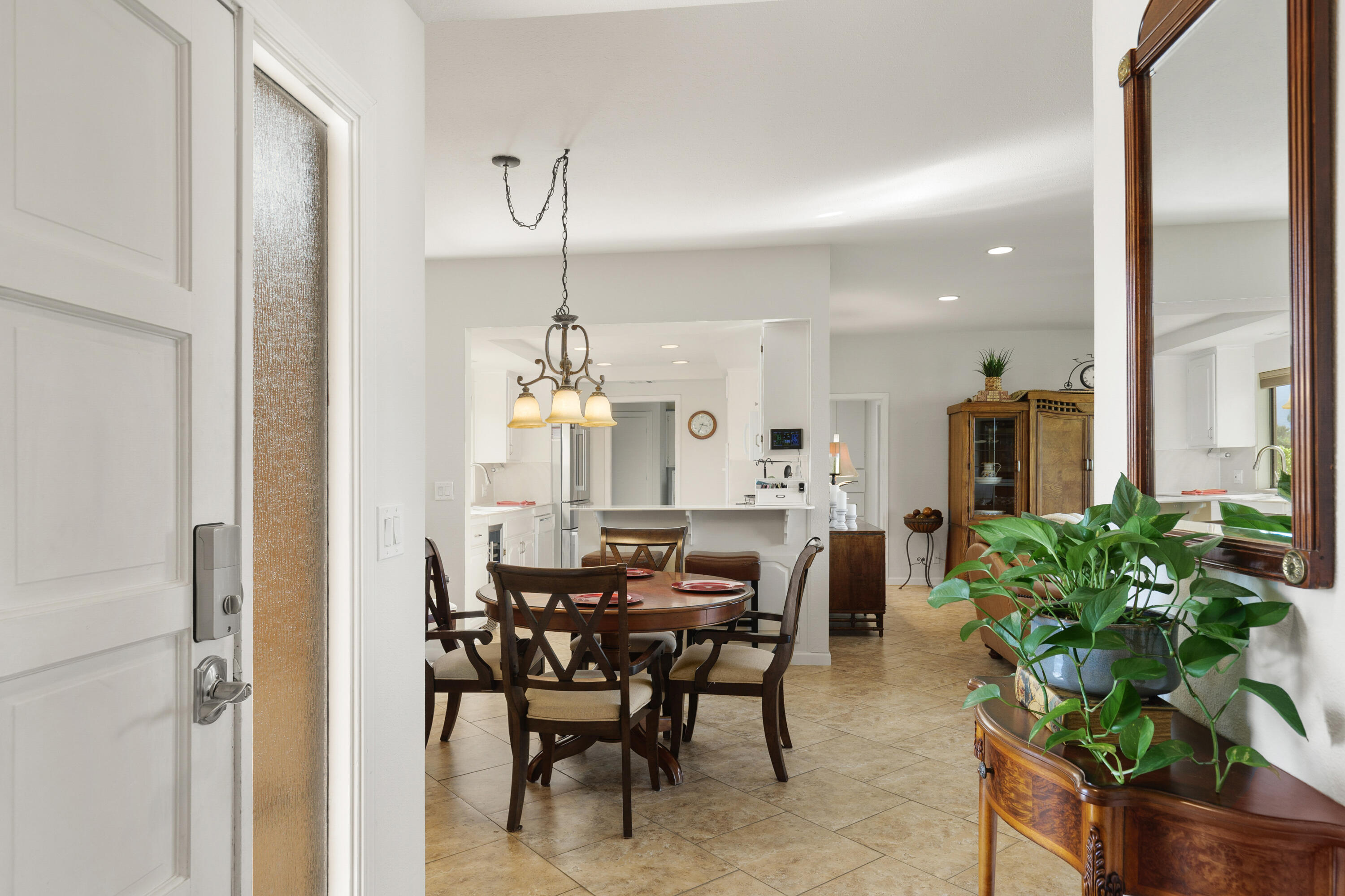 42410 Adams Street Bermuda Dunes, CA 92203 - Photo 9 of 39 a view of a dining room with furniture and wooden floor