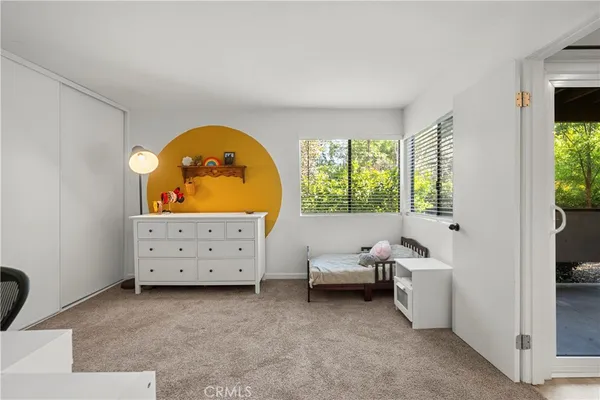 a view of living room with furniture and window