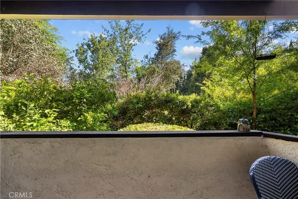 a view of a chairs and table in the patio