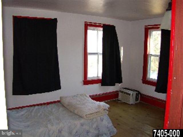 810 White Oak Road Windsor, PA 17366 - Photo 8 of 12 a bedroom with a bed and a window