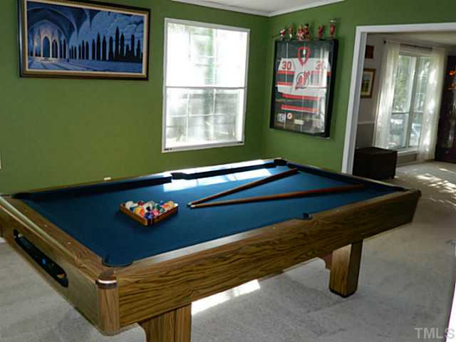 2028 Carpenter Pond Road Raleigh, NC 27613 - Photo 13 of 23 a room with furniture pool table and windows