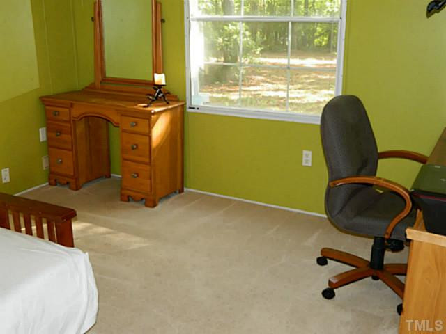2028 Carpenter Pond Road Raleigh, NC 27613 - Photo 16 of 23 a workspace with furniture and a window