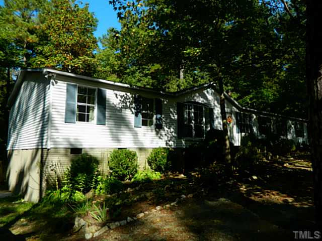 2028 Carpenter Pond Road Raleigh, NC 27613 - Photo 2 of 23 a view of a house with a yard