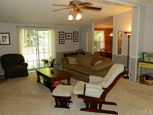 2028 Carpenter Pond Road Raleigh, NC 27613 - Photo 7 of 23 a living room with furniture and a window