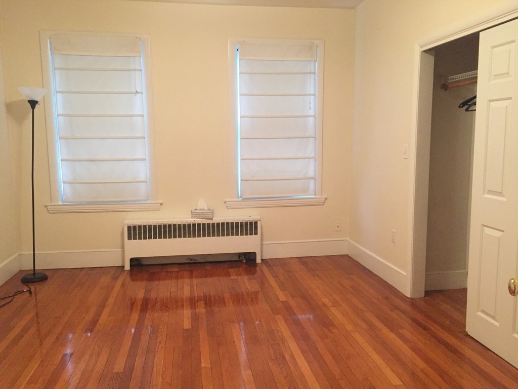15 Ellery Street, Unit 11 Cambridge, MA 02138 - Photo 7 of 10 a view of a room with wooden floor and a window