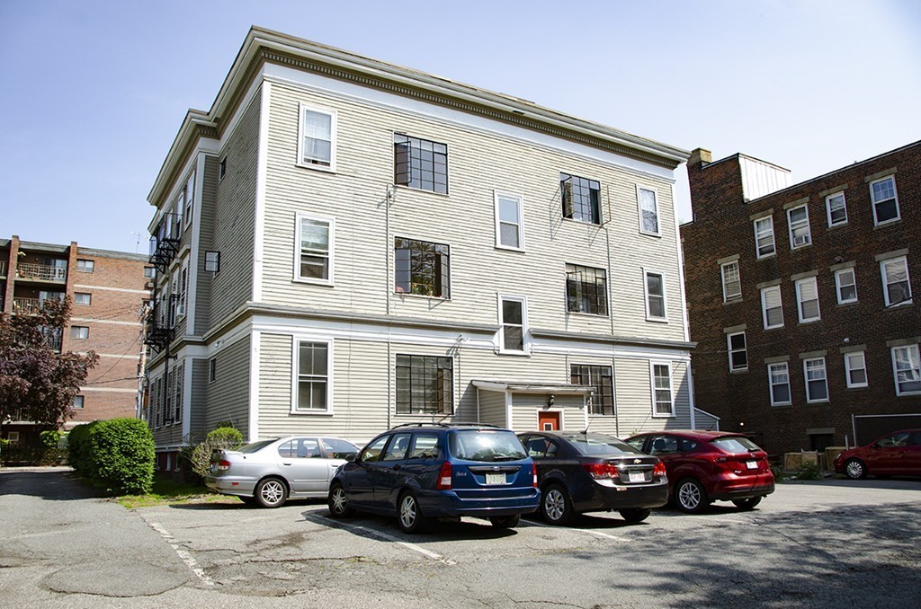15 Ellery Street, Unit 11 Cambridge, MA 02138 - Photo 10 of 10 a black car parked in front of a building