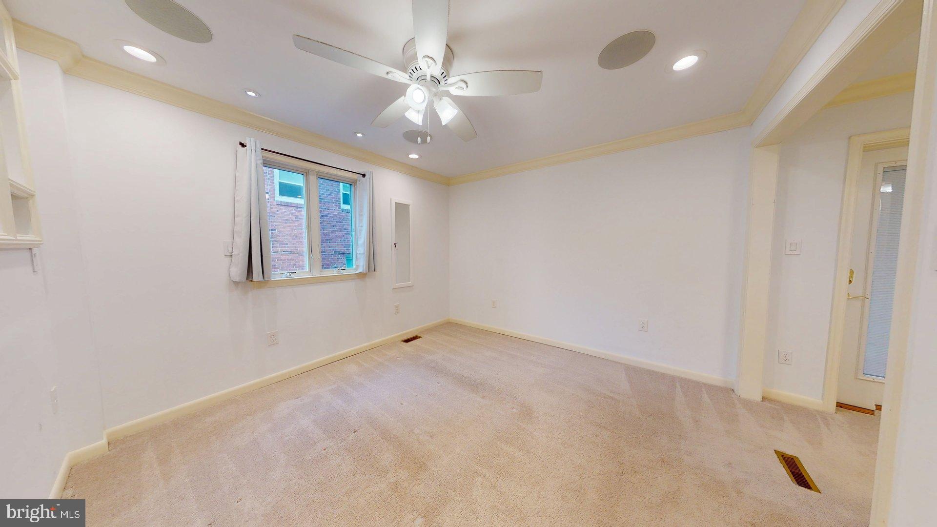 4145 21st Road North, Unit B Arlington, VA 22207 - Photo 12 of 29 an empty room with a ceiling fan and a window