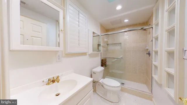 a view of empty room with wooden floor and window