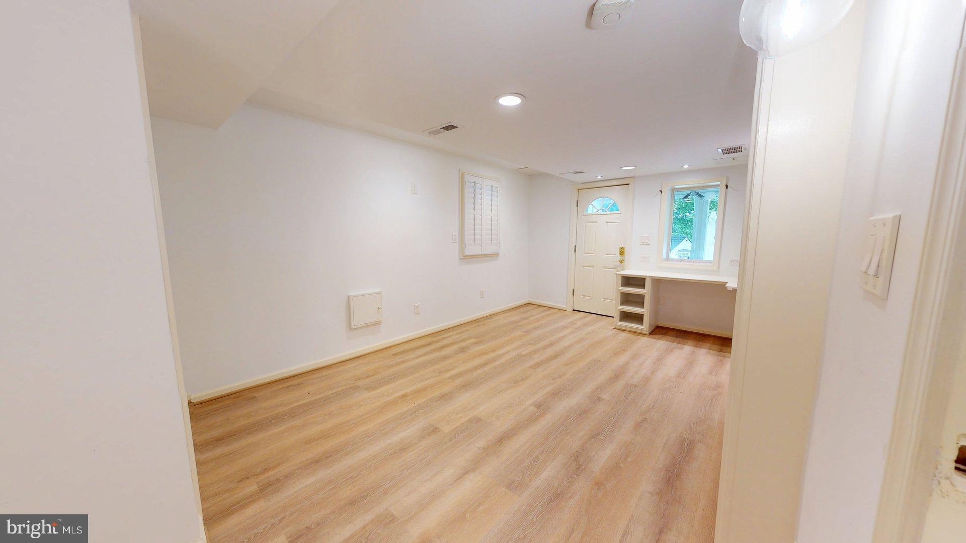 4145 21st Road North, Unit B Arlington, VA 22207 - Photo 20 of 29 a view of empty room with wooden floor and window