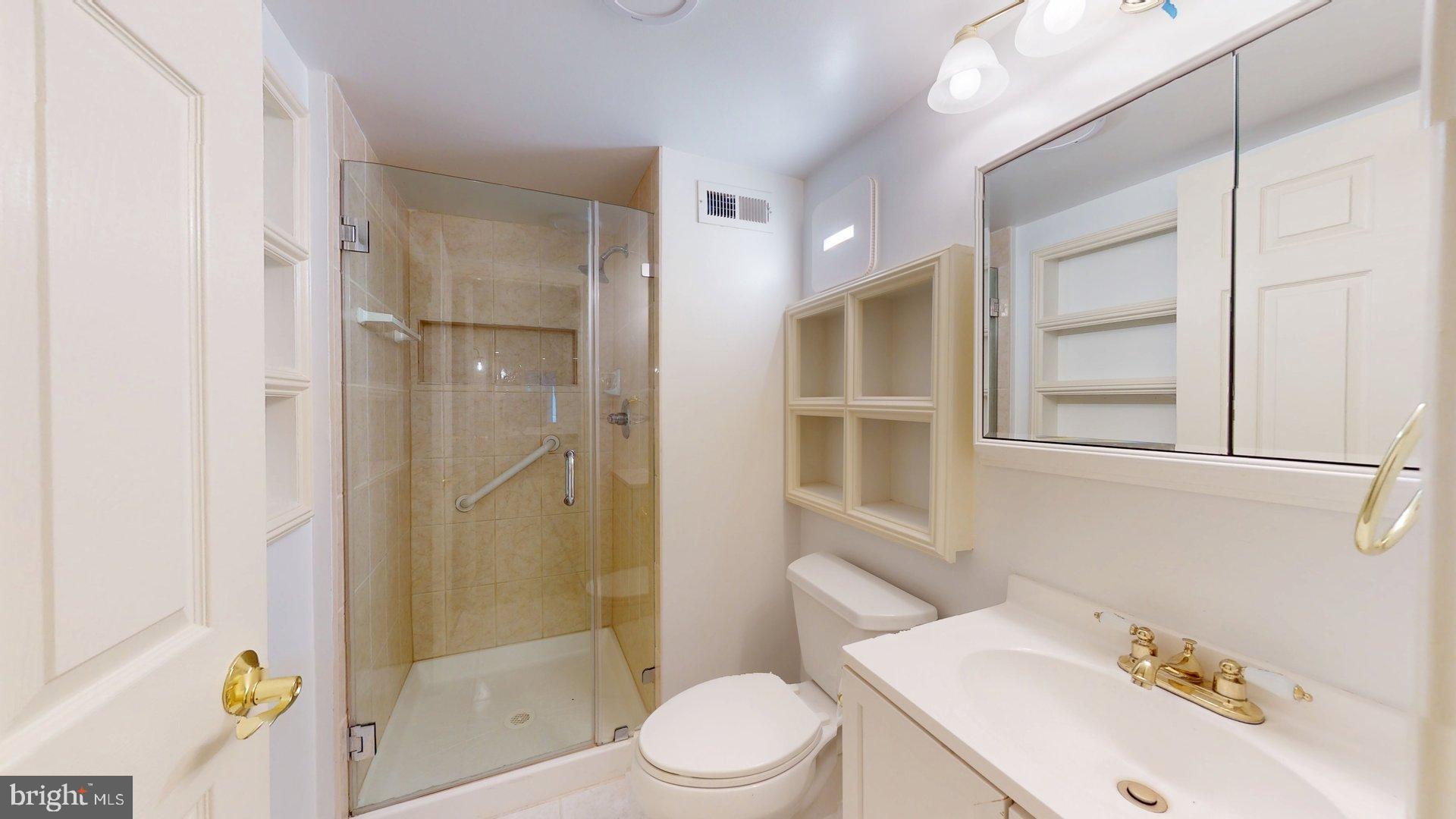 4145 21st Road North, Unit B Arlington, VA 22207 - Photo 22 of 29 a bathroom with a sink toilet and shower