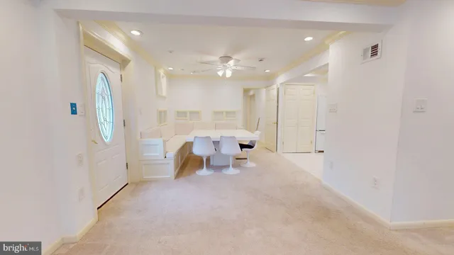 a view of living room with furniture and a chandelier