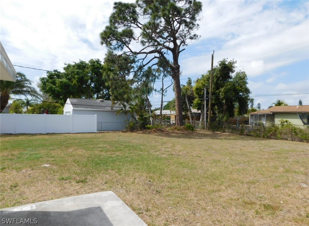 7277 Myrtle Road Fort Myers, FL 33967 - Photo 12 of 17 a backyard of a house with lots of green space