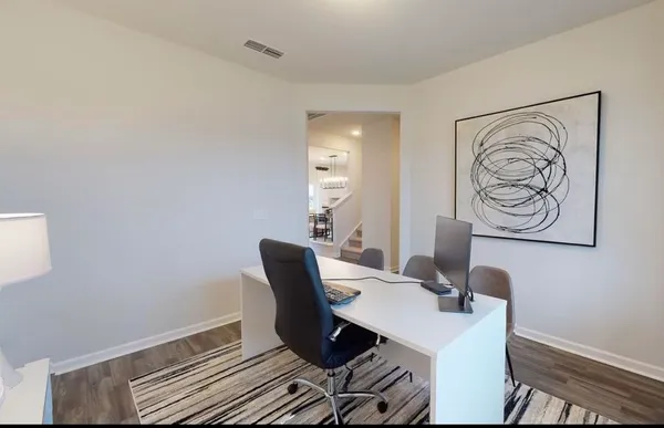 a workspace with furniture and lamp