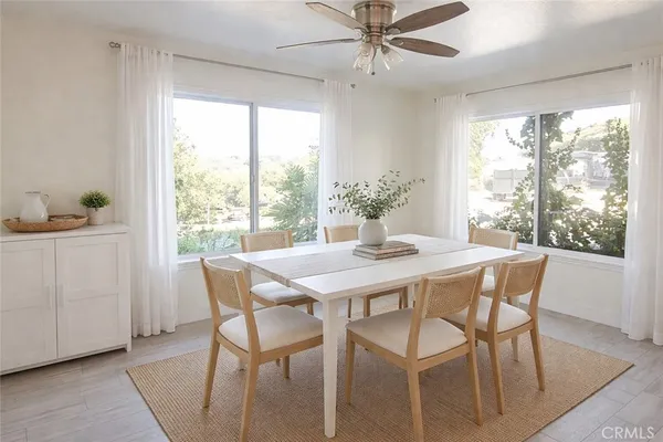 a view of a dining room with furniture window and outside view