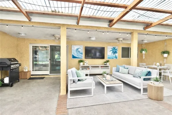 a living room with furniture and a large window