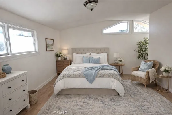 a bedroom with bed and window