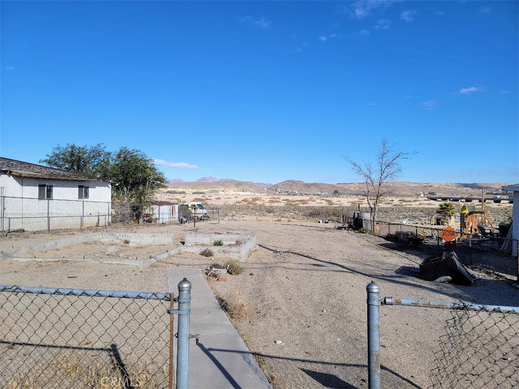 1519 Riverside Drive Barstow, CA 92311 - Photo 1 of 9 a view of a terrace with wooden floor and city view