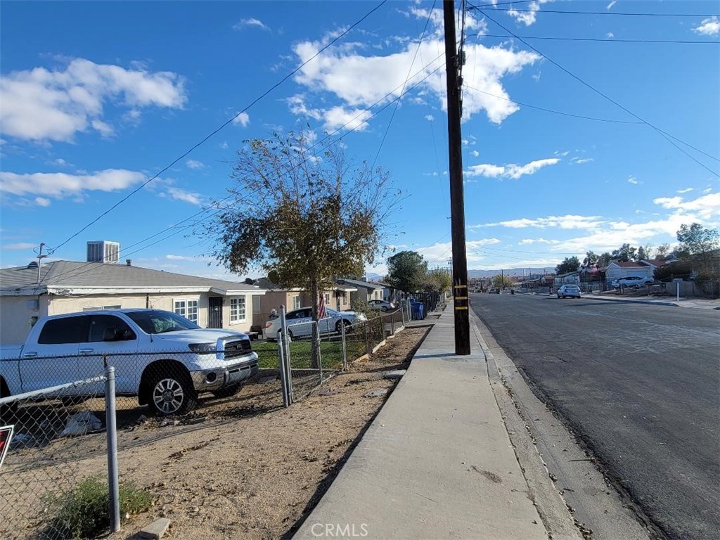 1519 Riverside Drive Barstow, CA 92311 - Photo 8 of 9 a front view of a house with cars parked