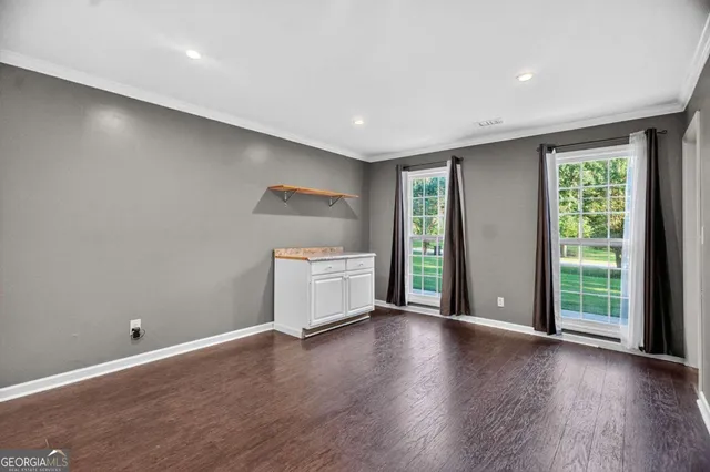 a kitchen with stainless steel appliances granite countertop a stove a refrigerator and a sink