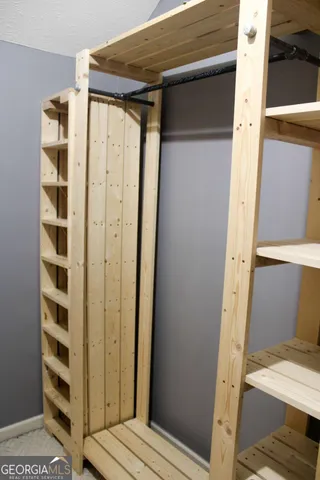 an aerial view of a house with a backyard