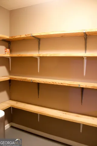 a view of a deck with chairs and wooden floor