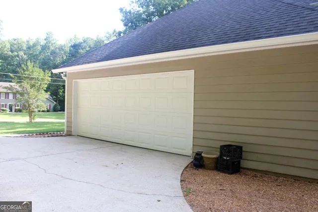 a view of a brick house with large windows