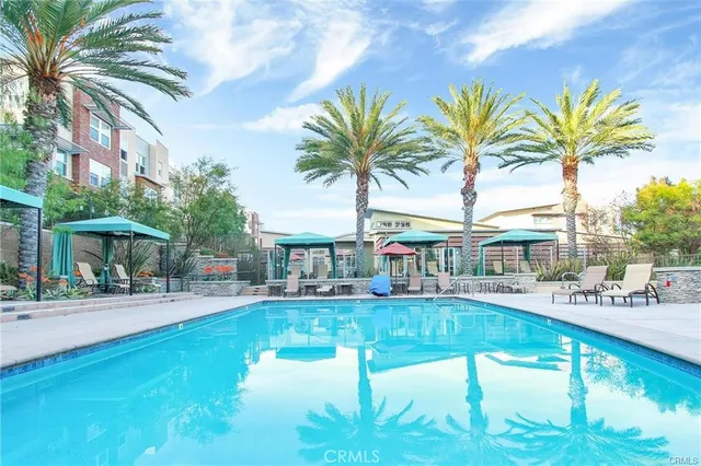 a house with swimming pool in front of it