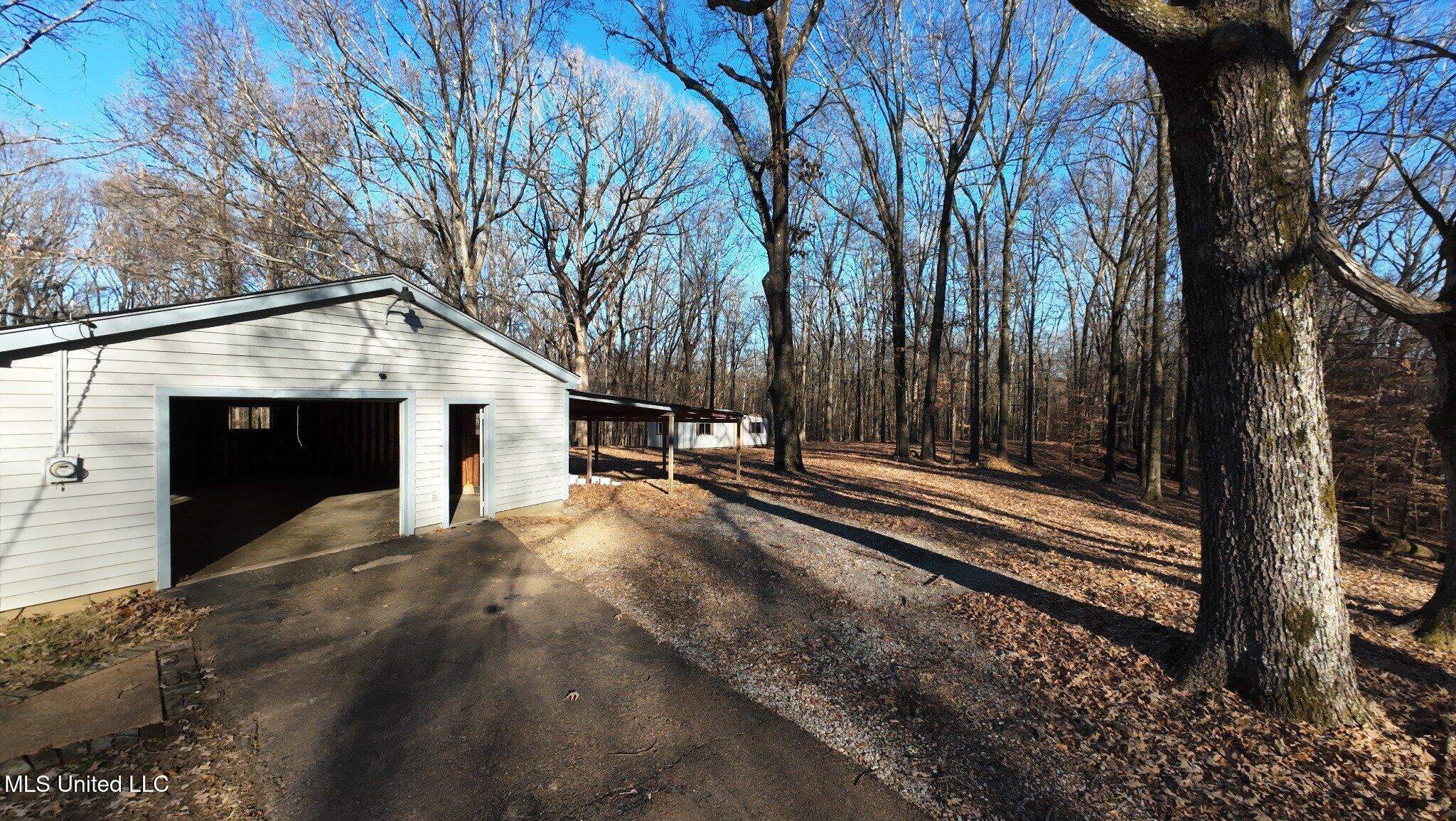 6650 Scenic Hollow Road Walls, MS 38680 - Photo 38 of 49 05_detached_garage_woods