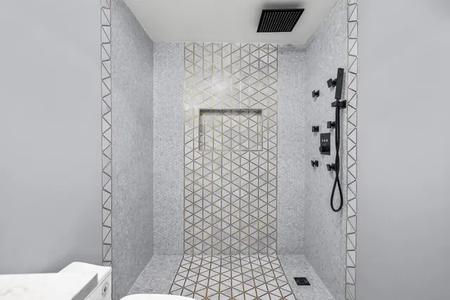 a view of a patio with table and chairs with wooden floor and fence