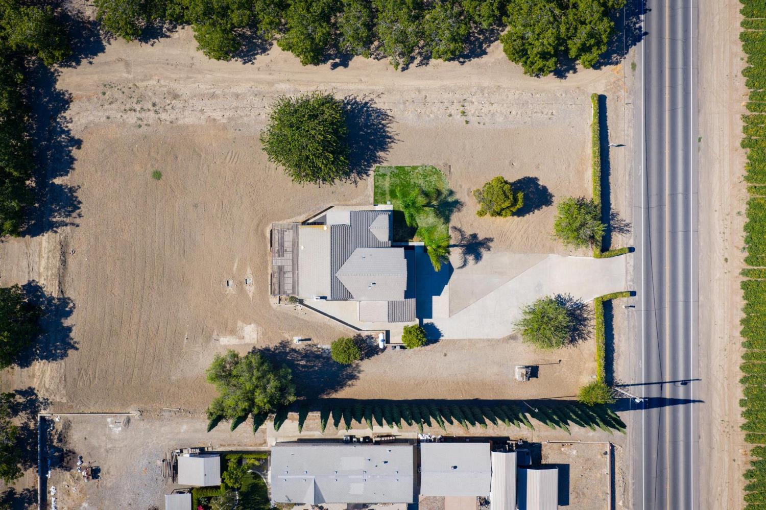 29879 South Chrisman Road Tracy, CA 95304 - Photo 3 of 50 an aerial view of a house with a yard and garden in the back