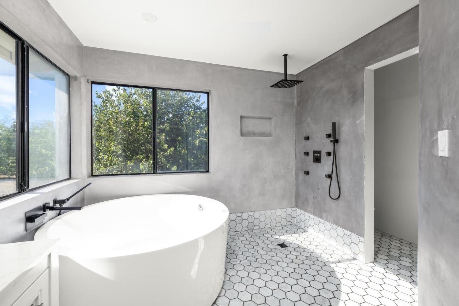 29879 South Chrisman Road Tracy, CA 95304 - Photo 31 of 50 a bath tub sitting in a bathroom next to a window