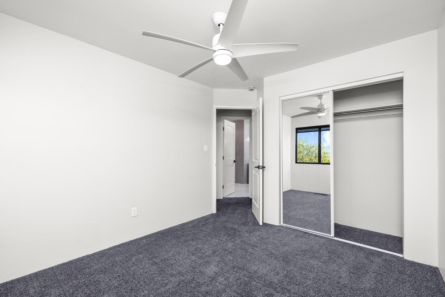 29879 South Chrisman Road Tracy, CA 95304 - Photo 39 of 50 an empty room with closet and a ceiling fan