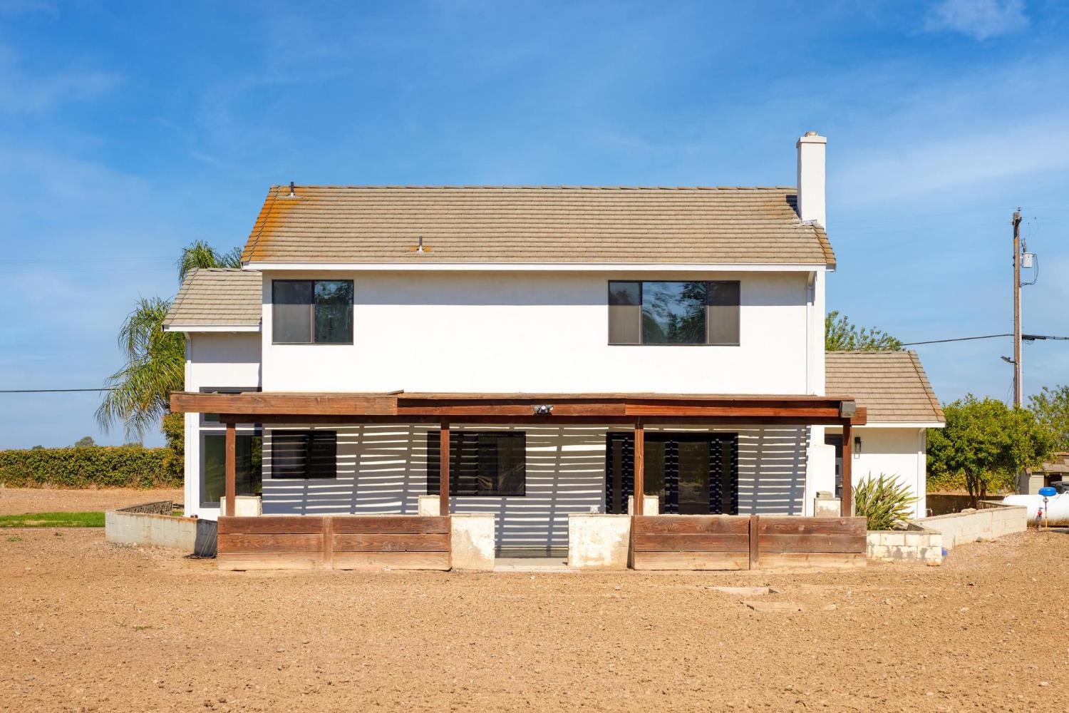 29879 South Chrisman Road Tracy, CA 95304 - Photo 47 of 50 a front view of a house with a yard