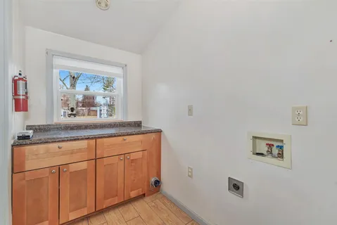 a view of cabinets and window