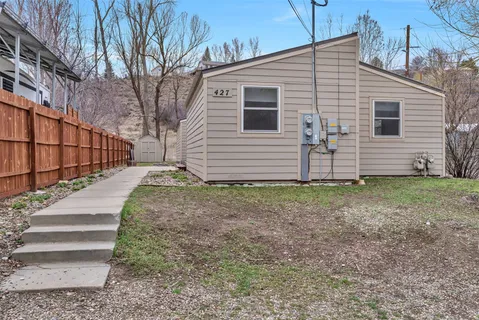 a view of a house with a yard