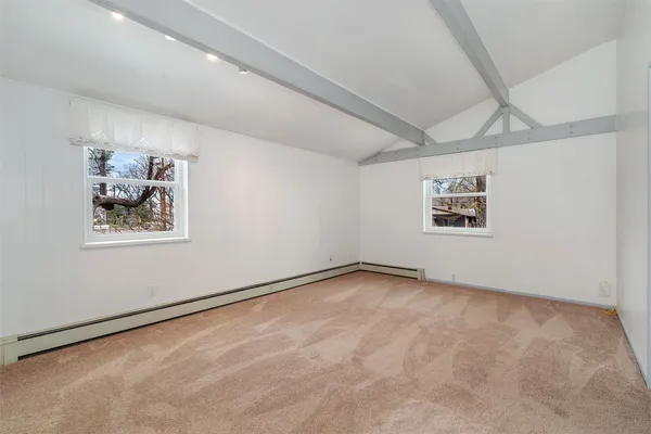 a view of a big room with window and closet
