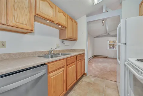 a kitchen with a stove and a refrigerator