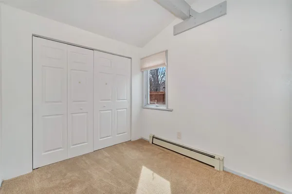 an empty room with closet area