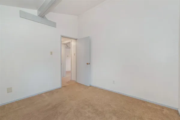 an empty room with closet area