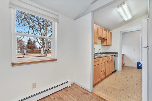a kitchen with stainless steel appliances a refrigerator and a stove top oven
