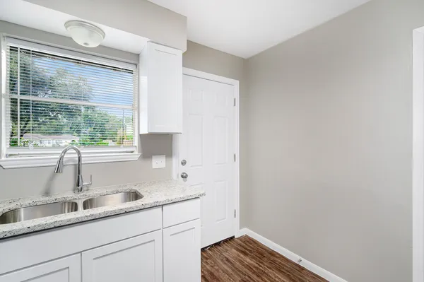 a kitchen with a sink and a window