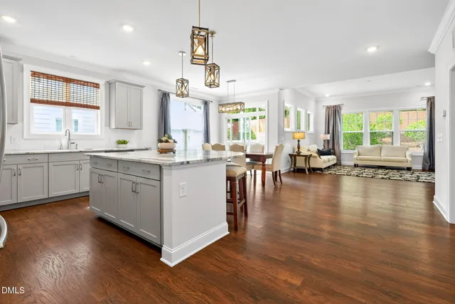 a view of a porch with a table and chairs