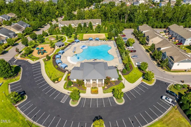 a view of a swimming pool with sitting area