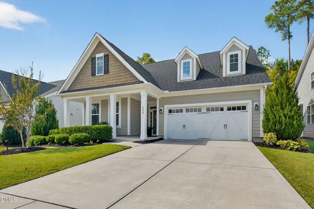 a spacious bedroom with a large bed and a window