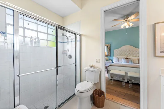 a en suite bathroom with a double vanity sink and a mirror